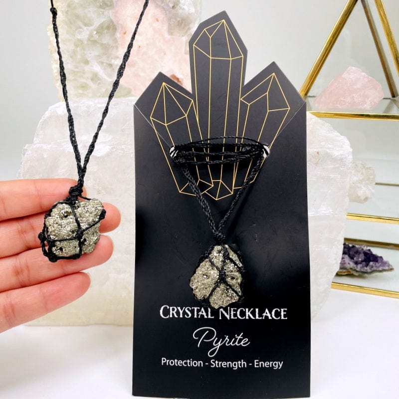 pyrite cluster necklace in hand for size reference 