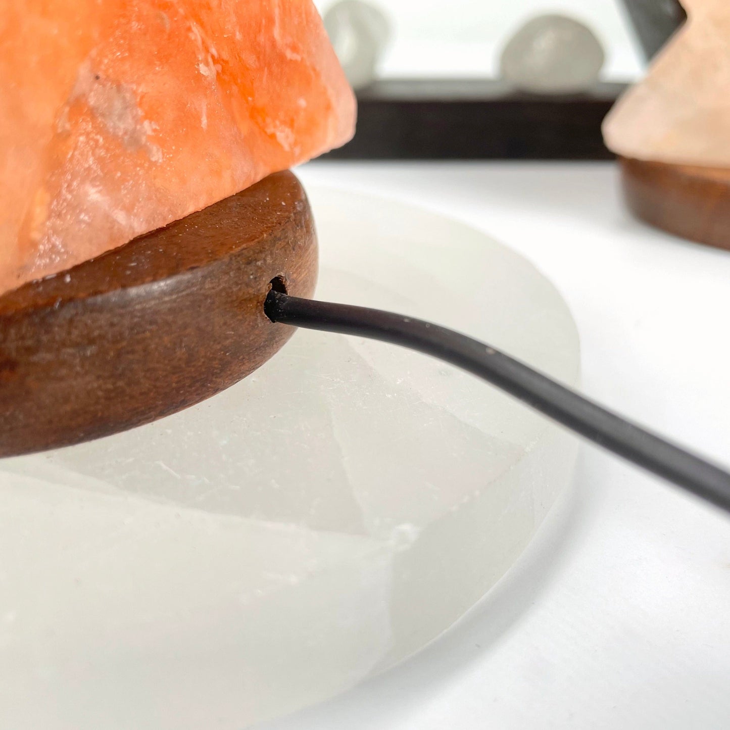 close up of back of himalayan salt orange star lamp to see USB cord