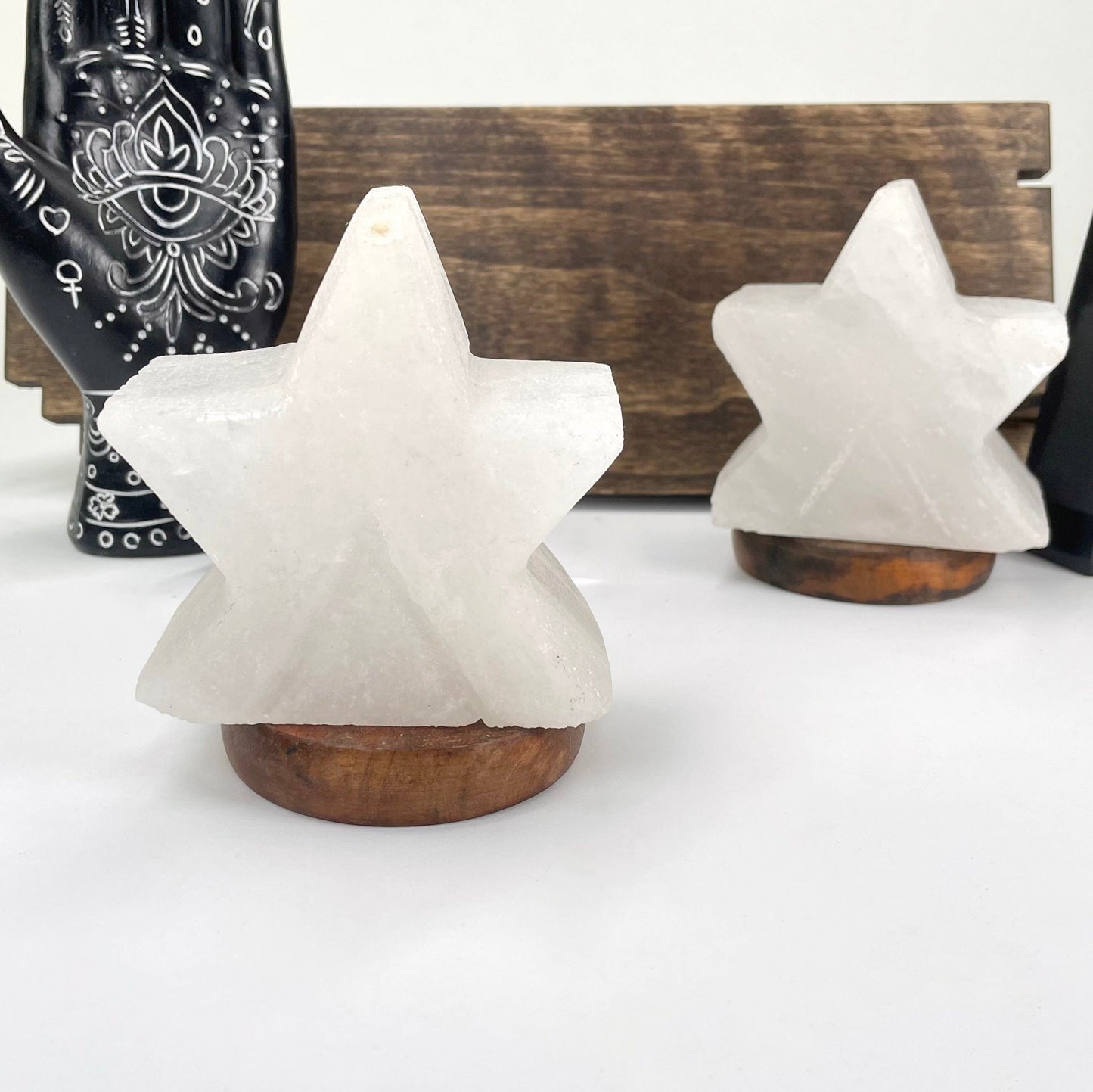 two himalayan salt white star lamps on display