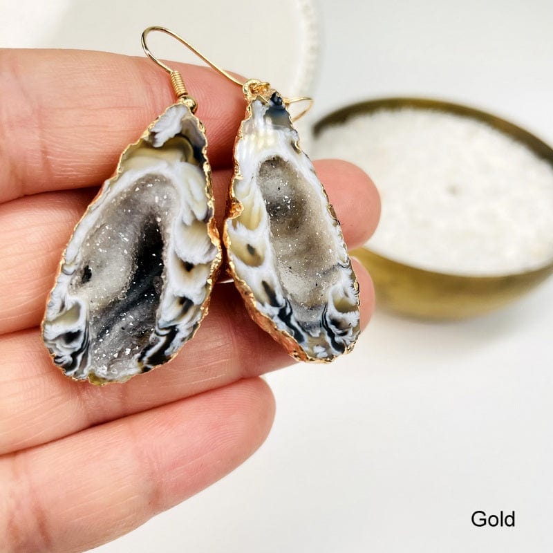 earrings in hand for size reference 