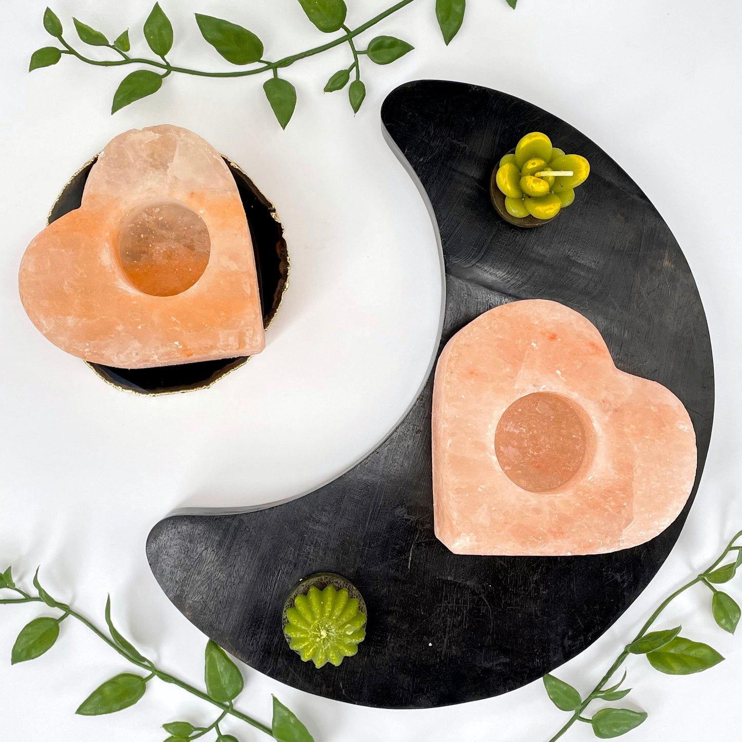 overhead view of two himalayan salt orange heart candle holders on display