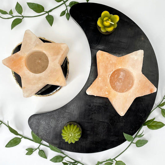 overhead view of two himalayan salt orange star candle holders on display
