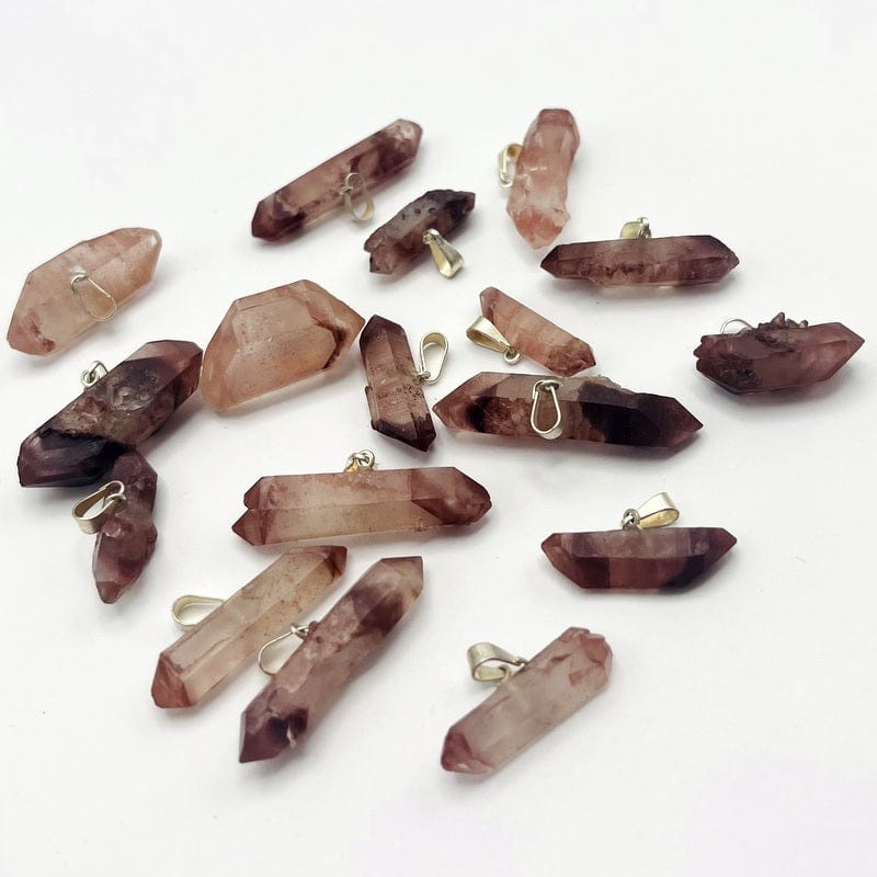 pendants displayed in different angles to show the thicknesses and color shades 