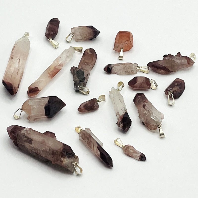 pendants displayed in different angles to show the thicknesses