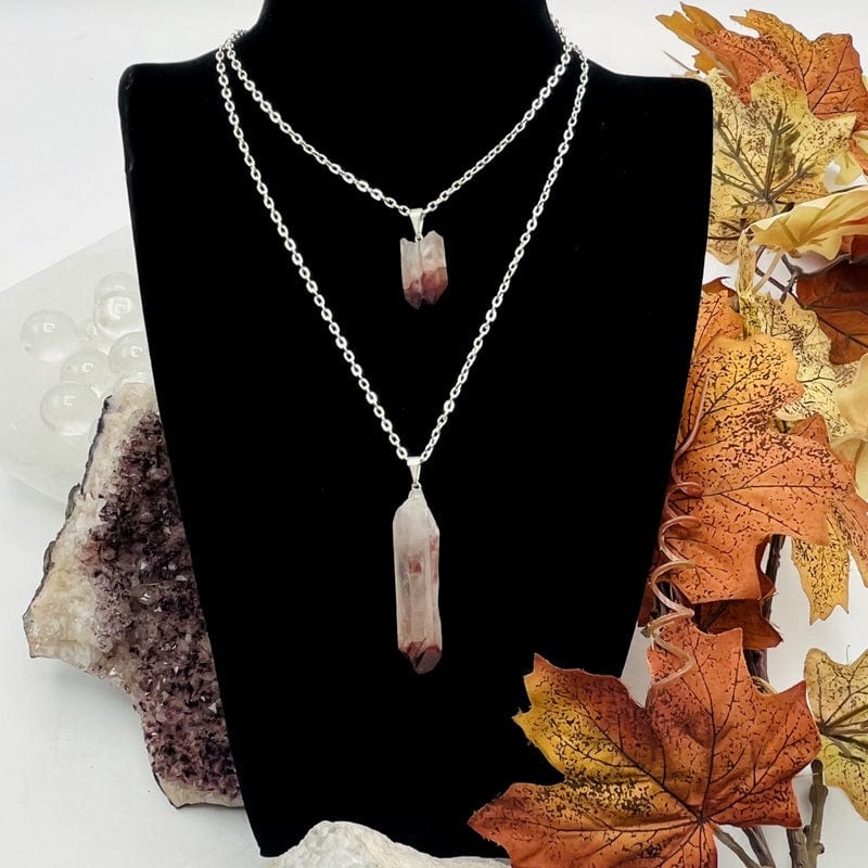 lithium quartz point pendant displayed on chain 