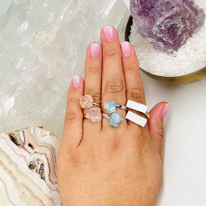 rings displayed on hand to show the different crystal types  