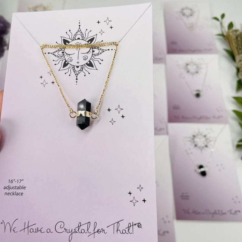 close up of a necklace on the display card it comes on 