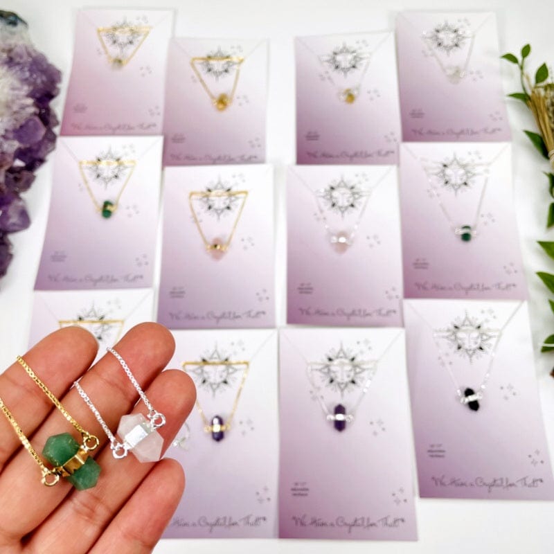 necklace pendants in hand for size reference 