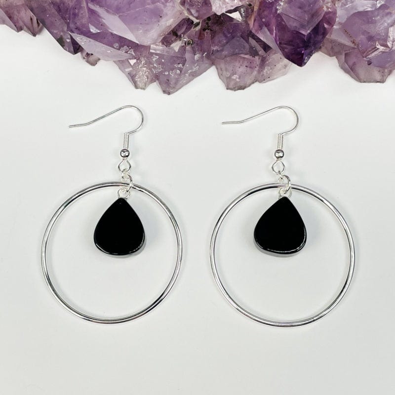 close up of the details on the silver finish earrings 