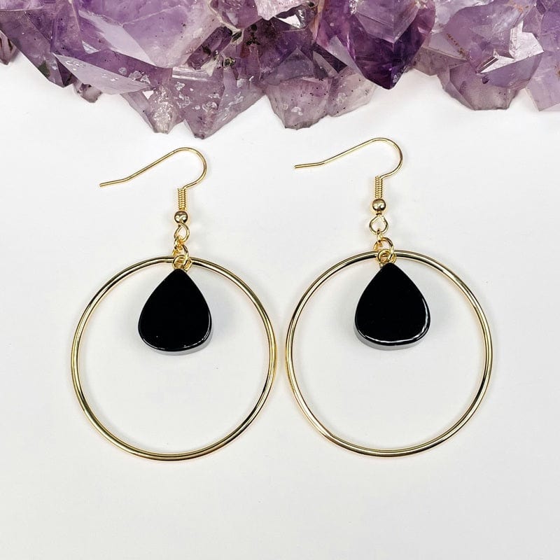 close up of the details on the gold finish earrings 