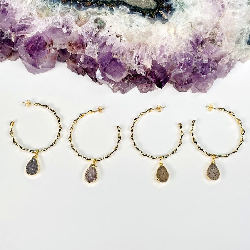 two pairs displayed next to each other to show the differences in the agate druzy 