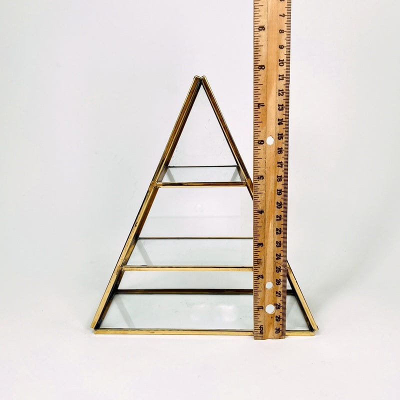 crystal display next to a ruler for size reference 