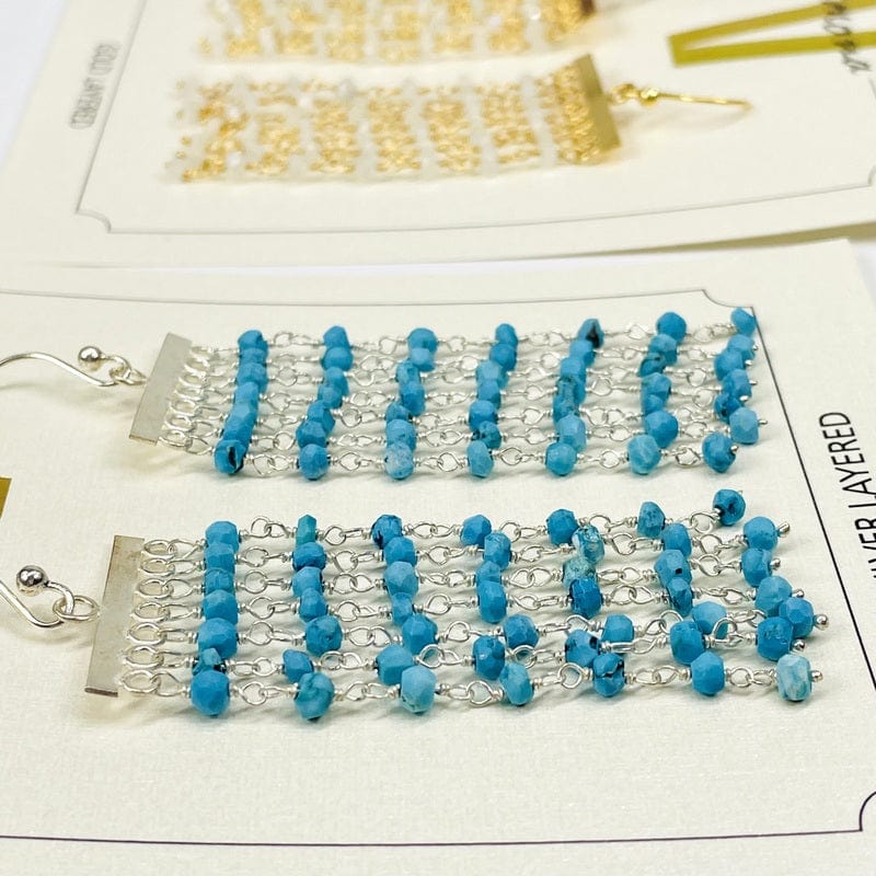 angled shot of gemstone cascade earrings