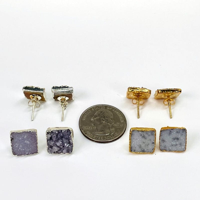 earring pairs next to a quarter for size reference 