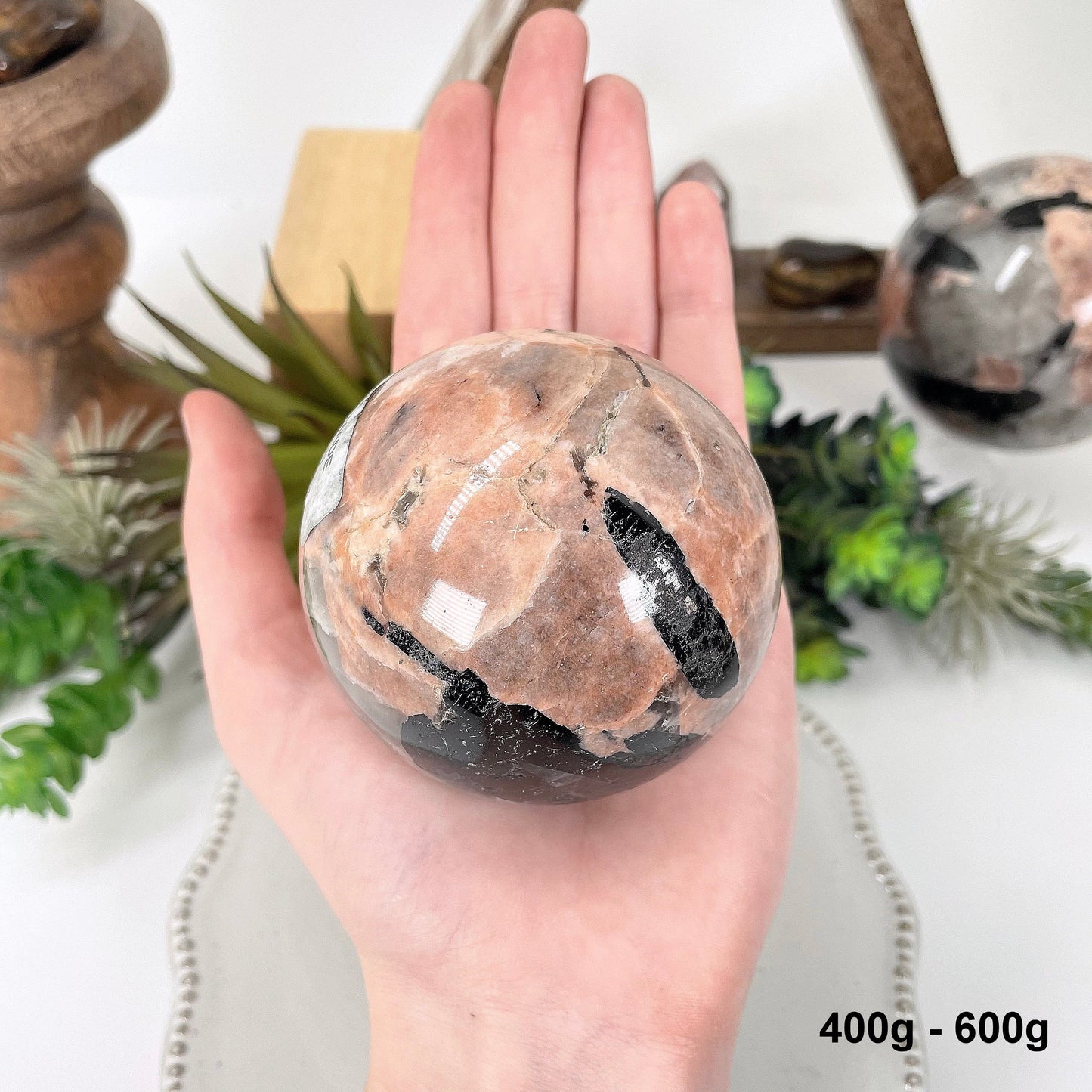 one 400g - 600g sphere in hand for size reference