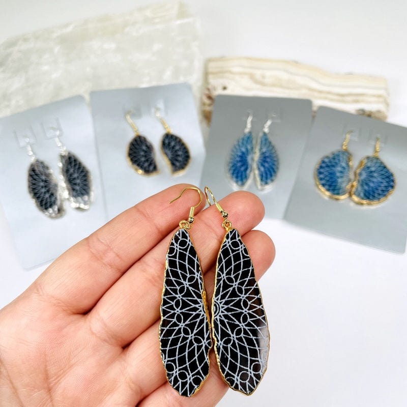 agate earrings in hand for size reference 