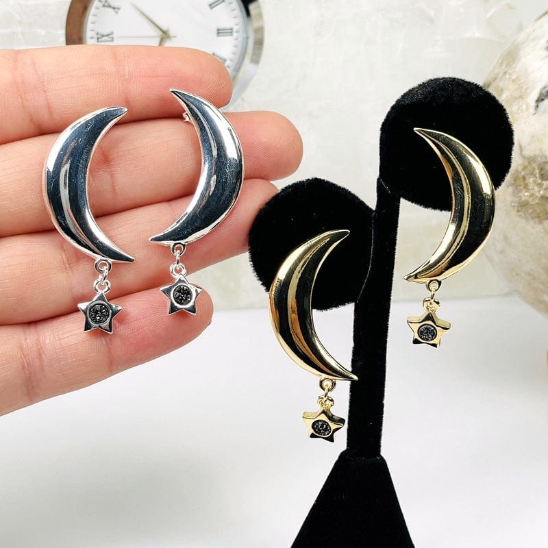 moon crescent with a star druzy accent hanging on the bottom  