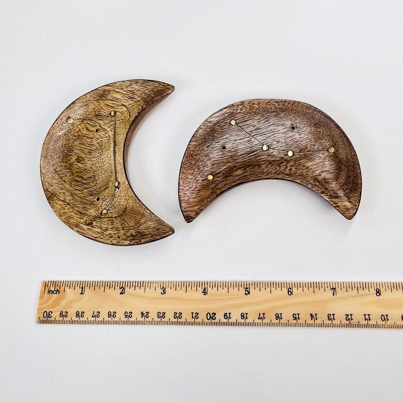 incense holders next to a ruler for size reference 