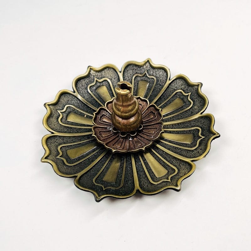 close up of the details on the brass incense holder 