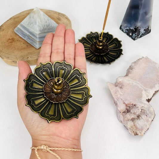 brass lotus flower in hand for size reference 