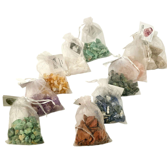 Crystal Stones Tagged & Tied in an Organza Bag- all variants in organza bags with tag on a white background