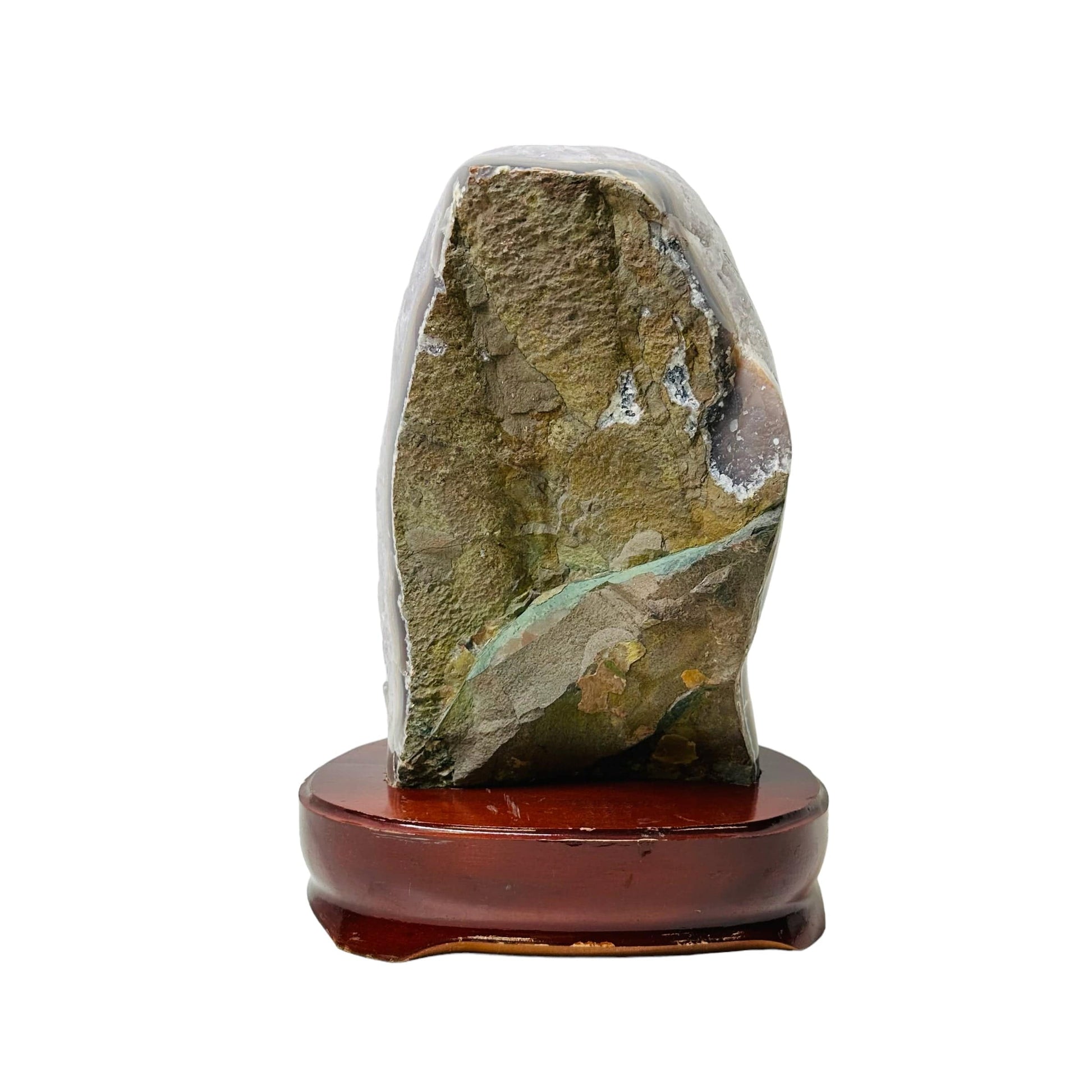 back side of the amethyst on wooden stand. it is left raw and natural 
