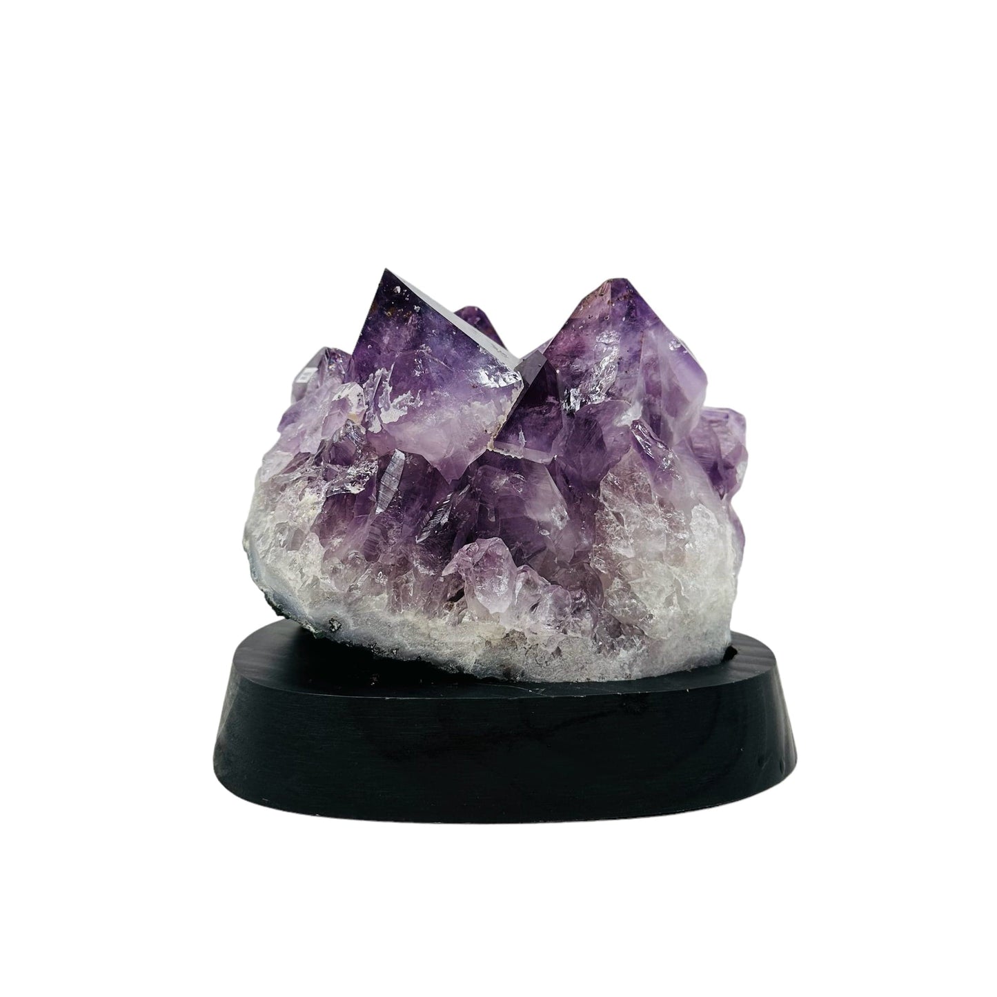 back side of the amethyst cluster on wooden base 