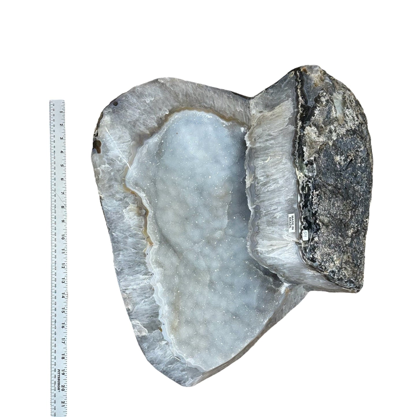 large cluster displayed next to a ruler for size reference 