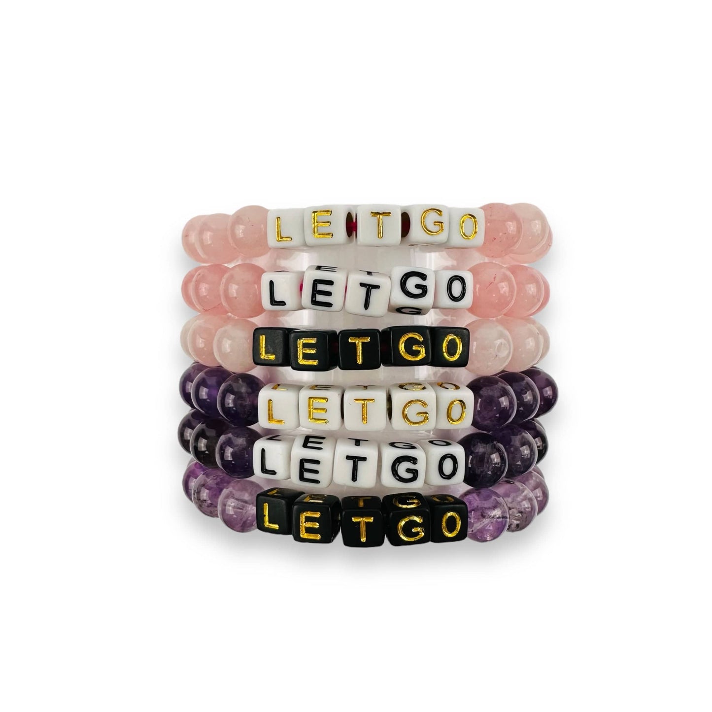Crystal Mala Bead Bracelet - LET GO - in amethyst and rose quartz, showing the options of white and black bead with gold and black lettering