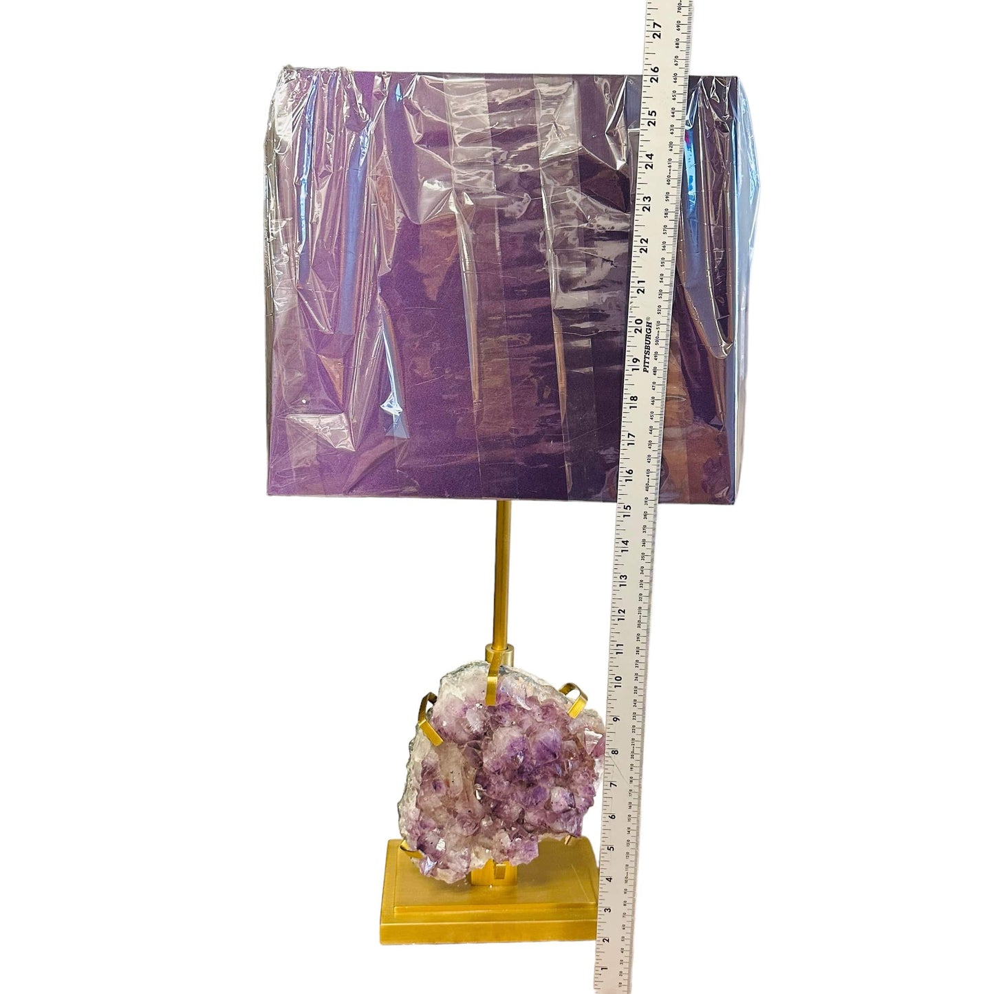 lamp next to a ruler for size reference 