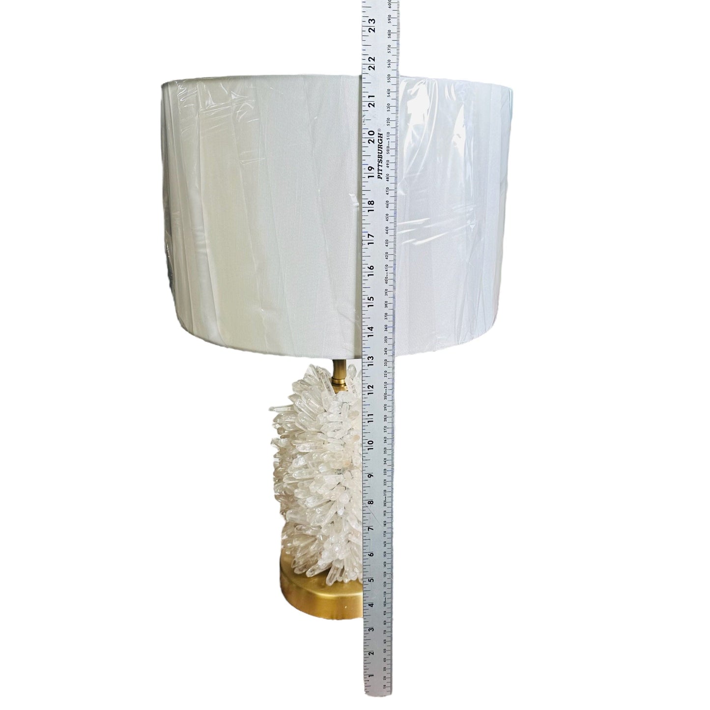lamp next to a ruler for size reference 