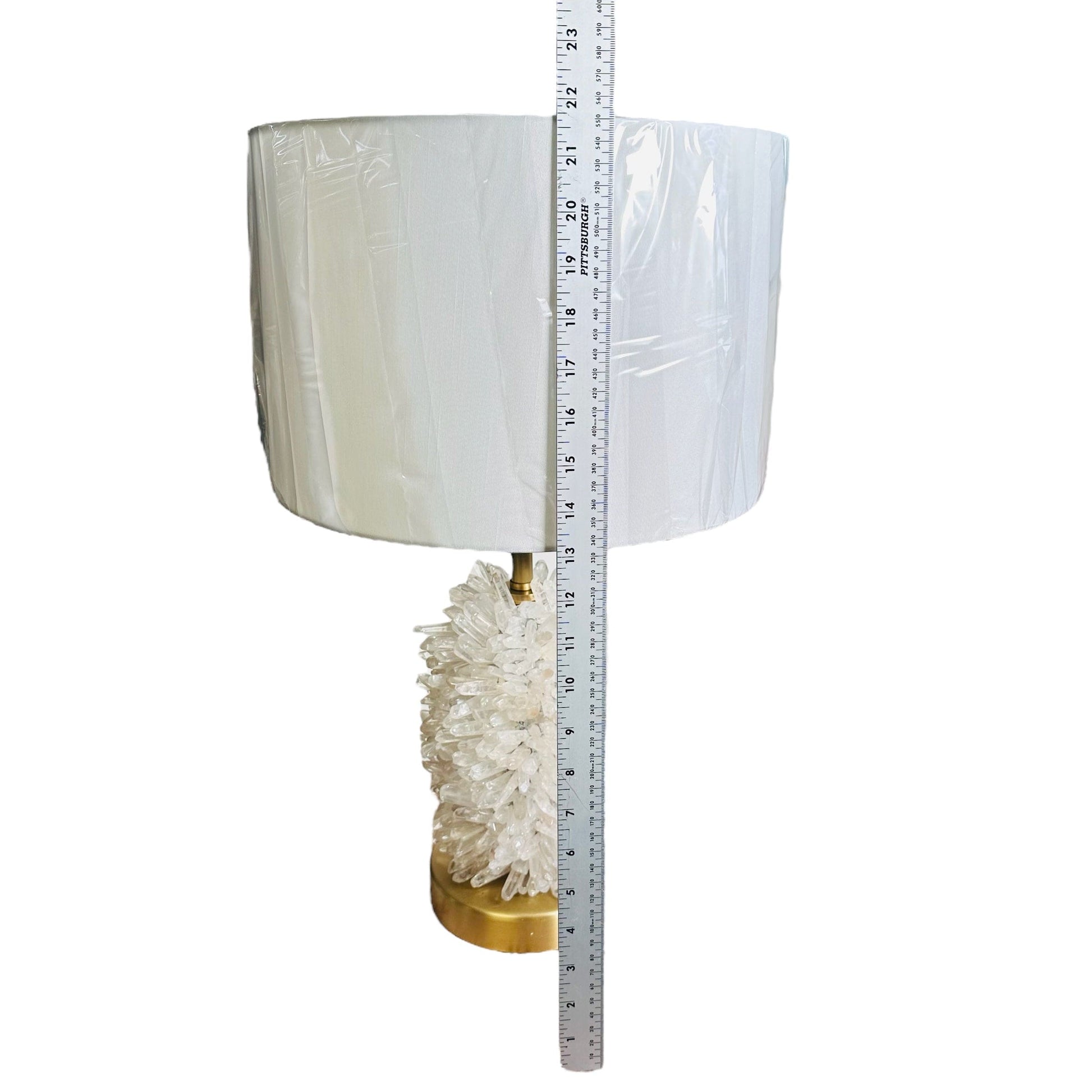 lamp next to a ruler for size reference 