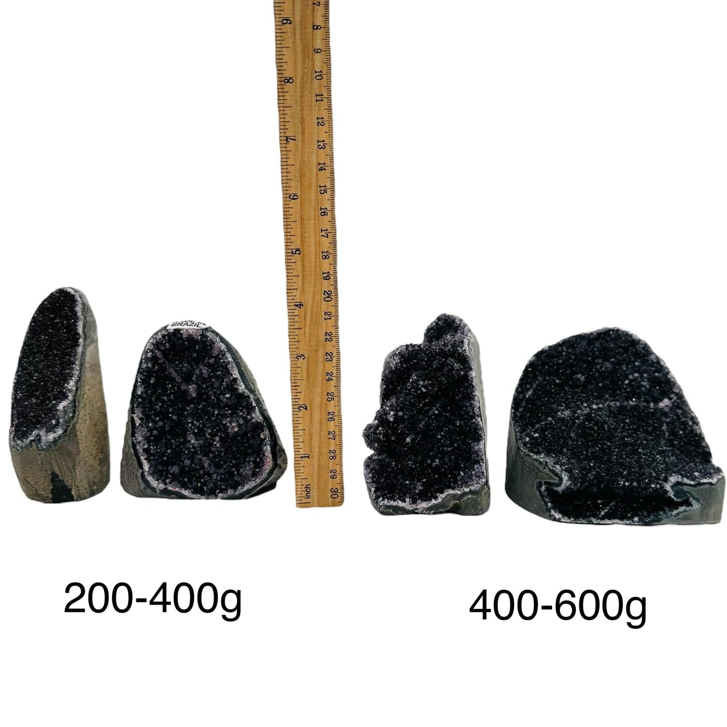 black amethyst druzy cut base crystals next to a ruler for size reference. sold by weight 