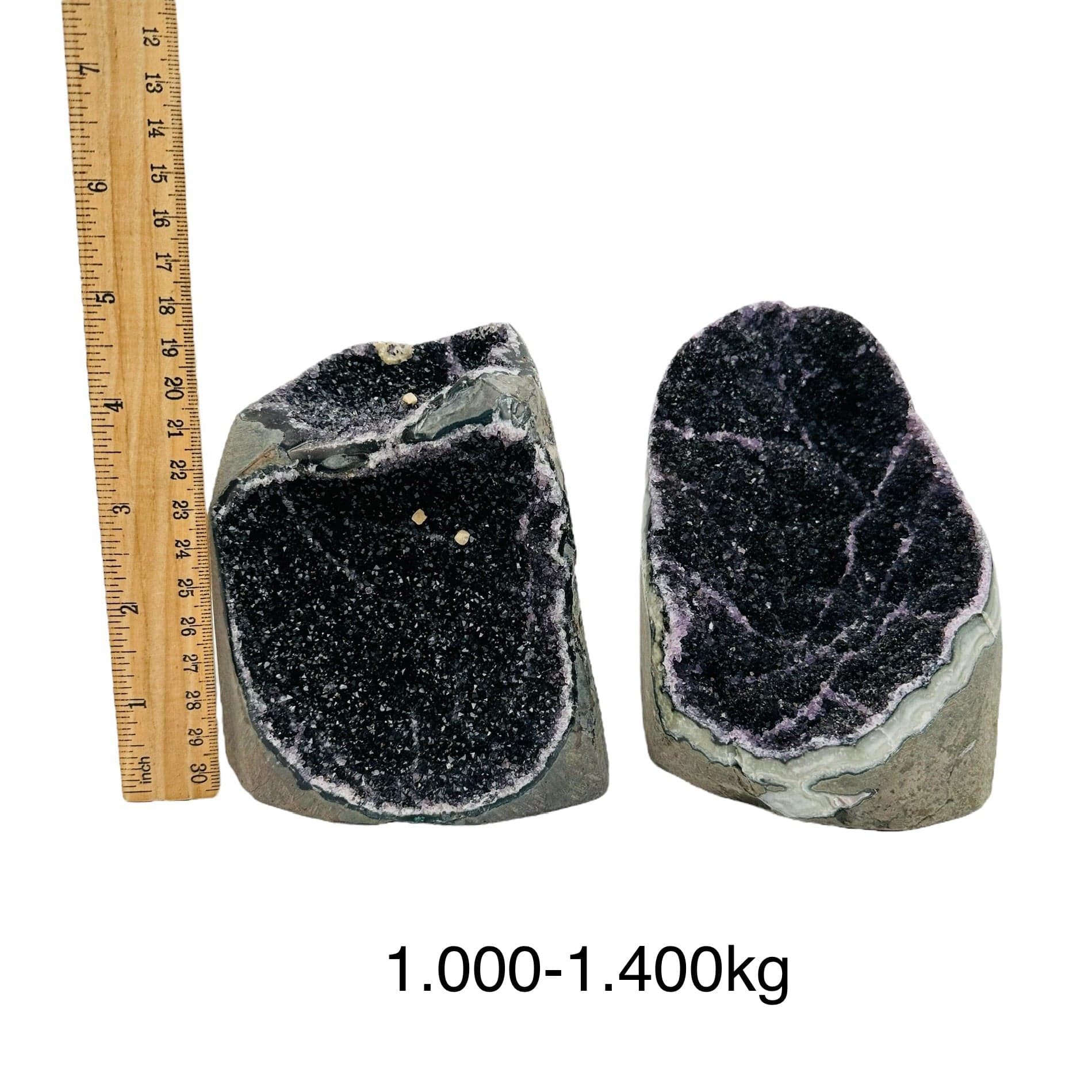 black amethyst druzy cut base crystals next to a ruler for size reference. sold by weight 