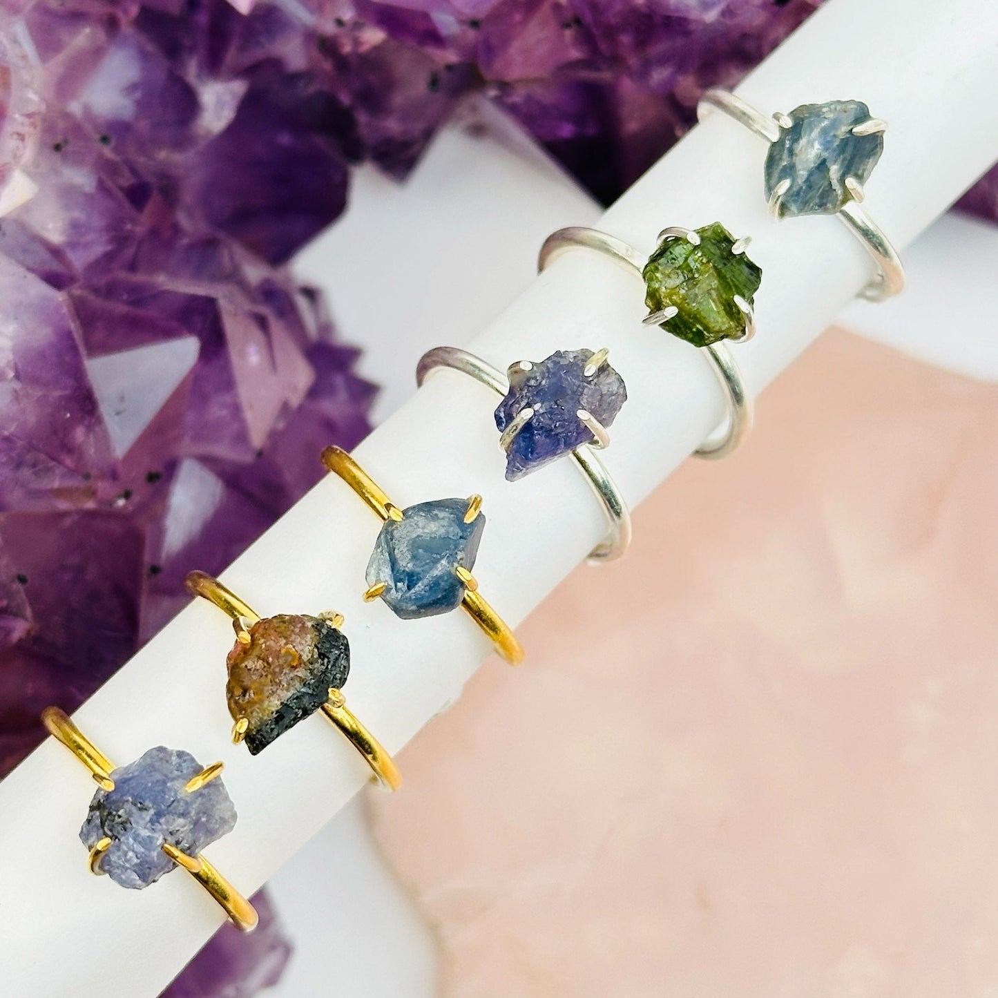 multiple rings displayed to show the differences in the gemstones 