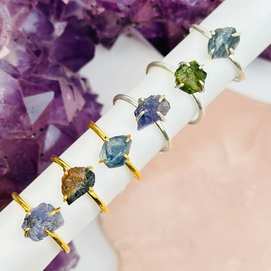 multiple rings displayed to show the differences in the gemstones 