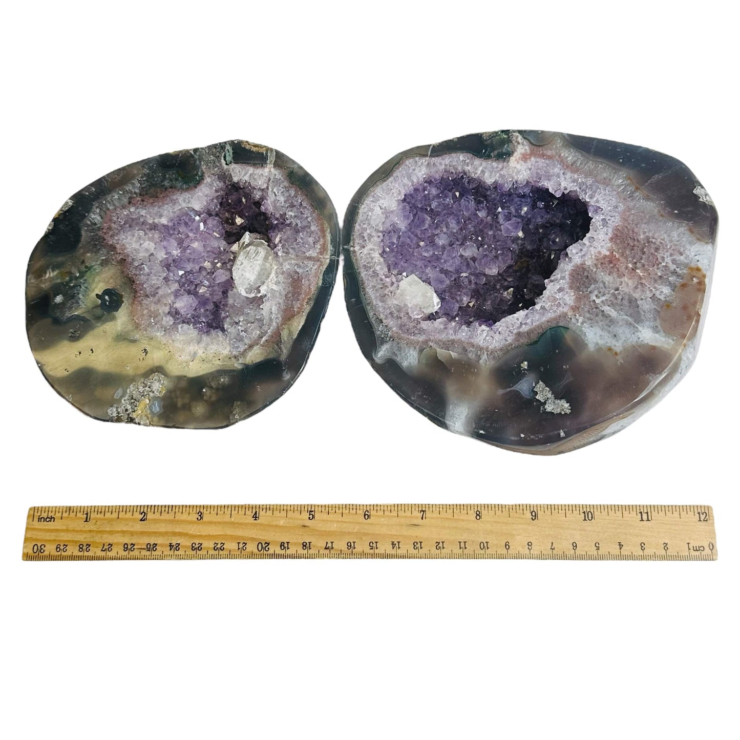 amethyst geode next to a ruler for size reference 