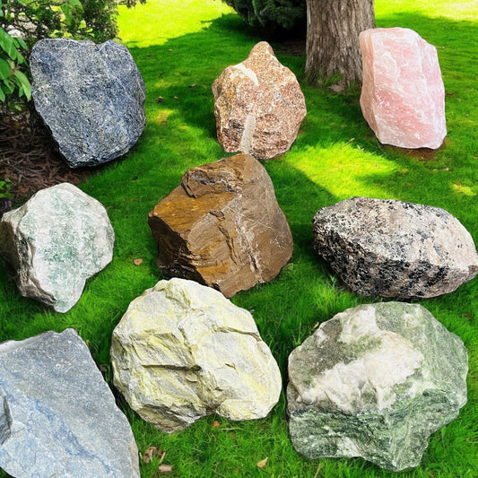 multiple large rough stone crystals displayed to show the differences in the sizes 