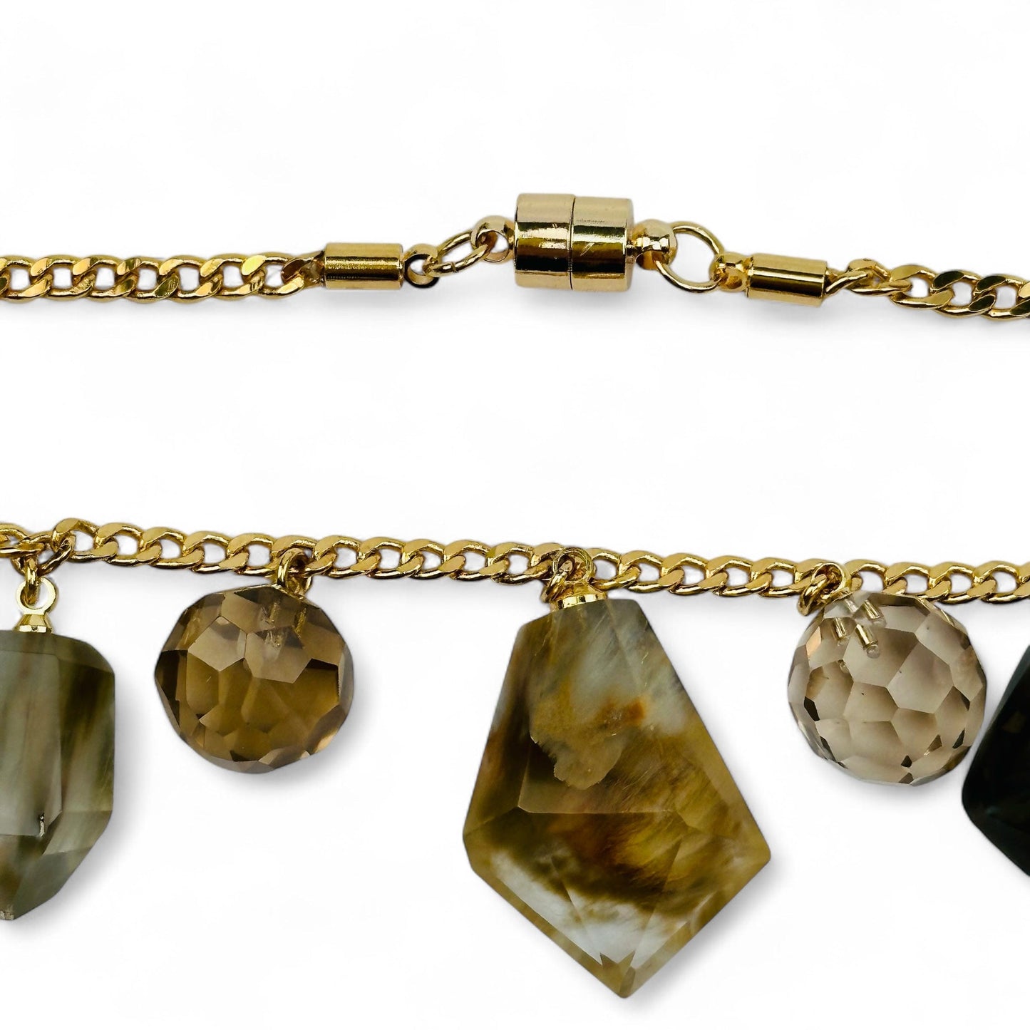 close up of the necklace charm and necklace clasp 