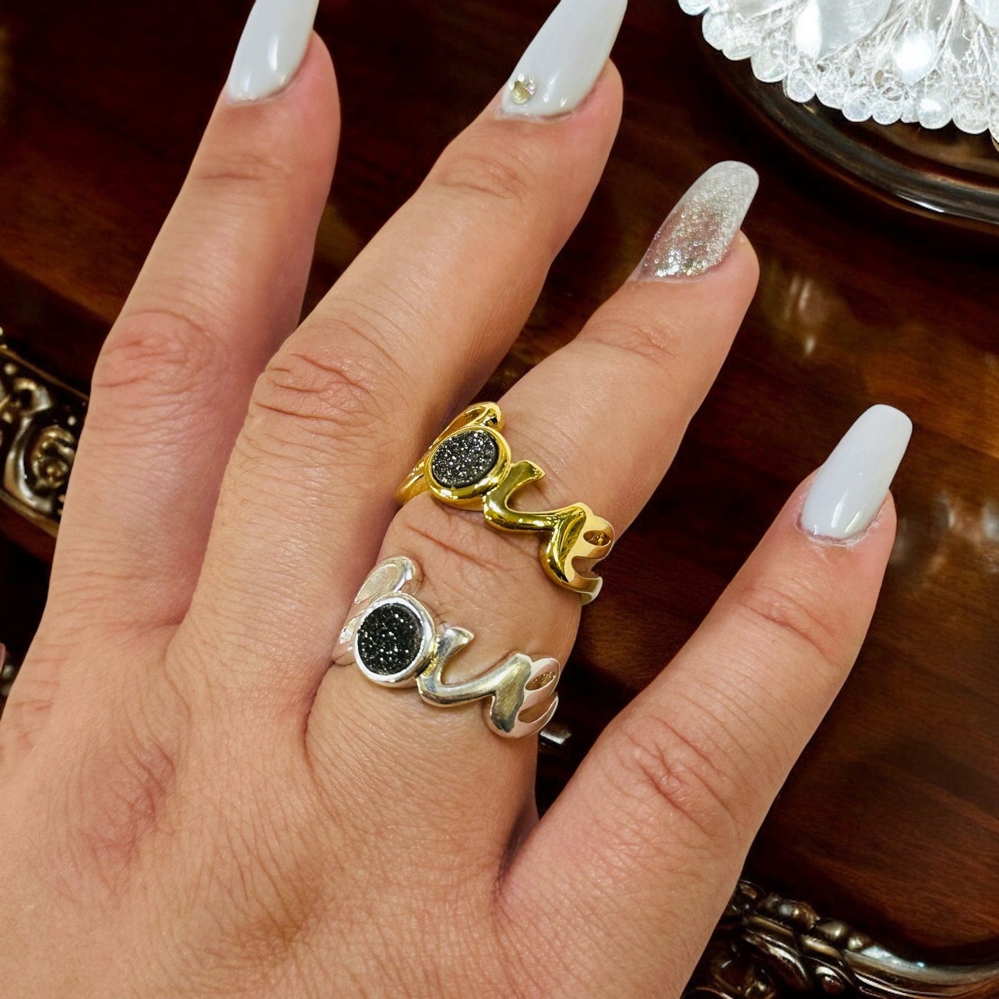 druzy ring with the word love on hand for size reference 