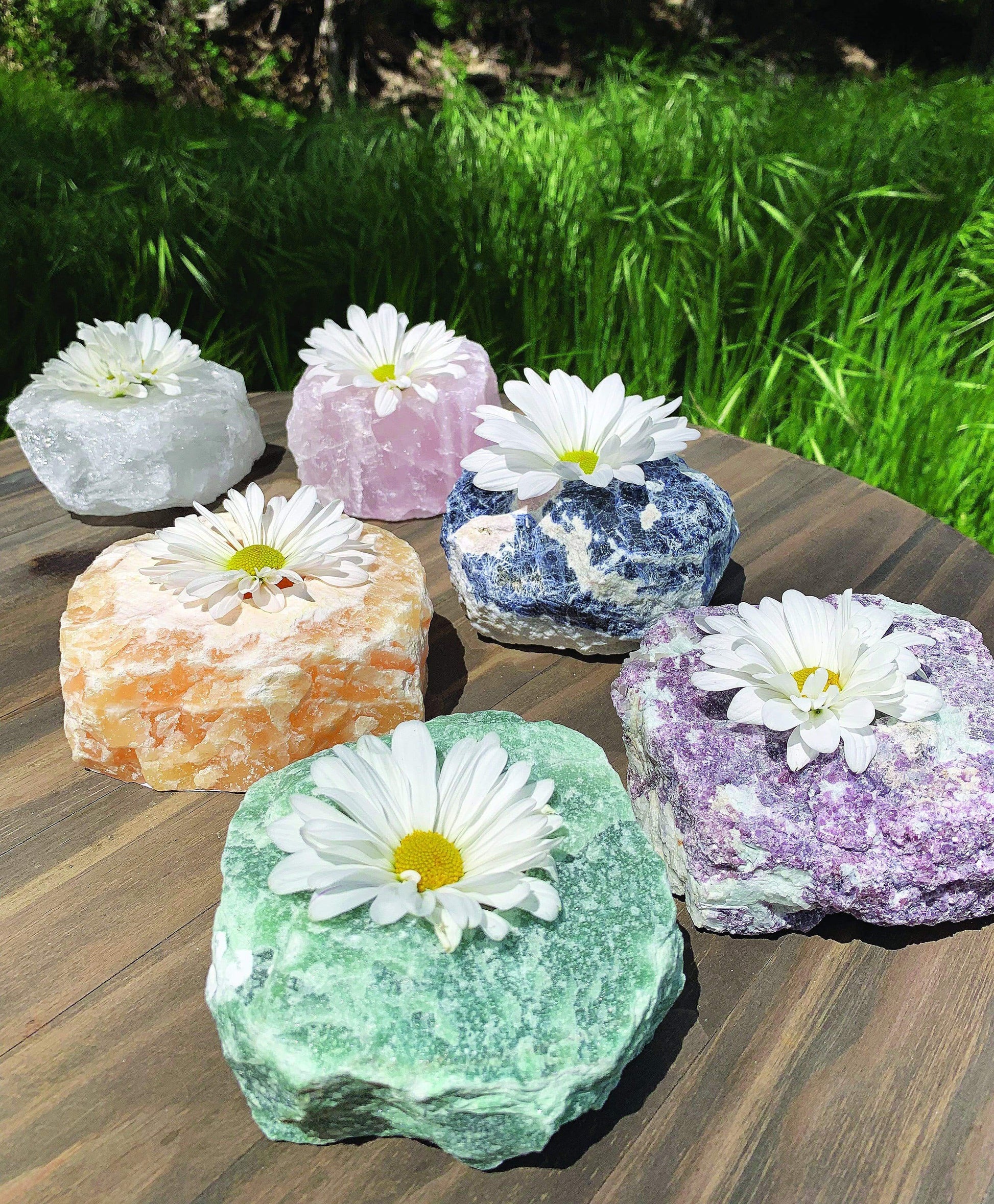 other candle holders that are available on the Rock Paradise website on display with flowers in the candle holder  hole
