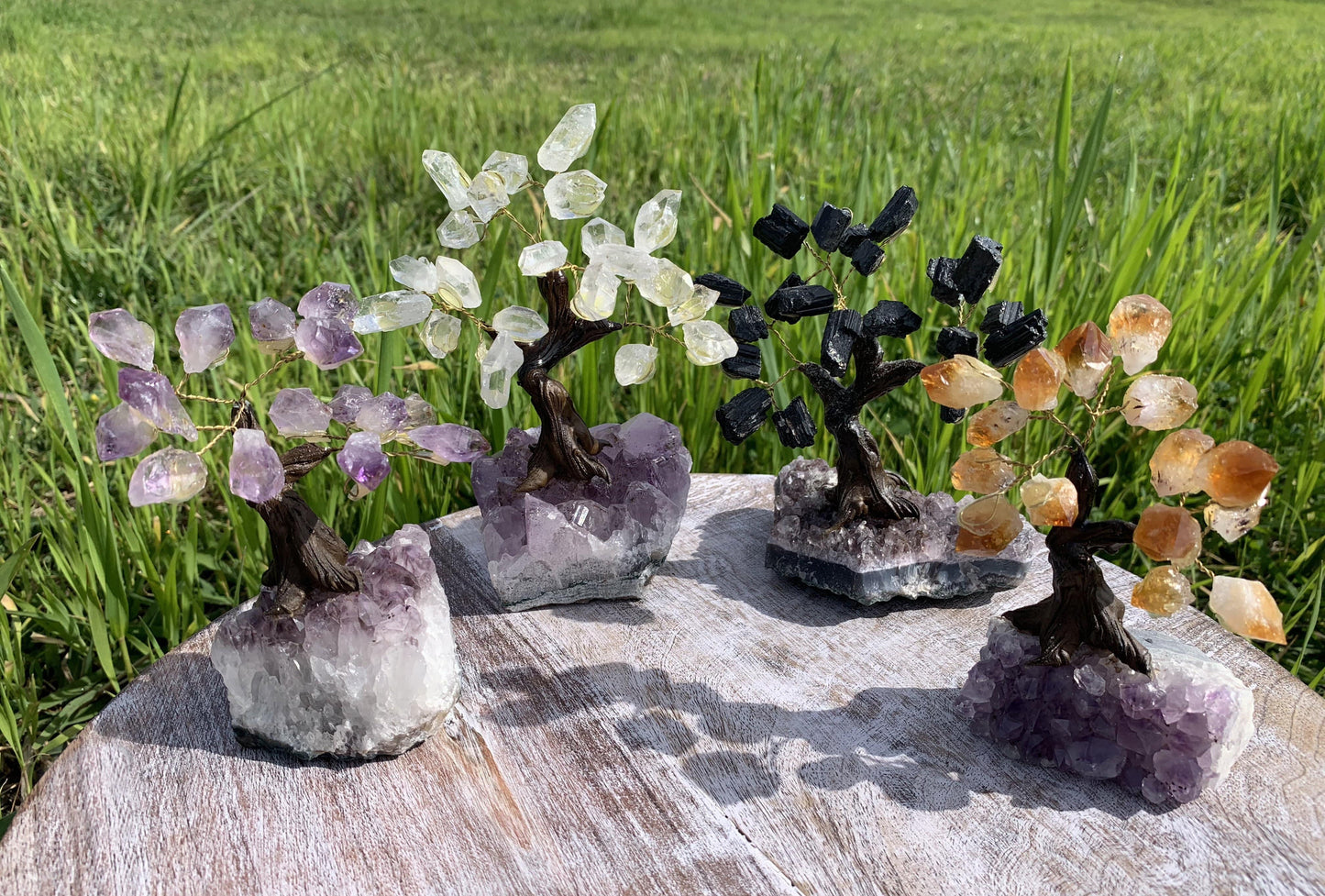 amethyst cluster base with gemstones made in to a tree 