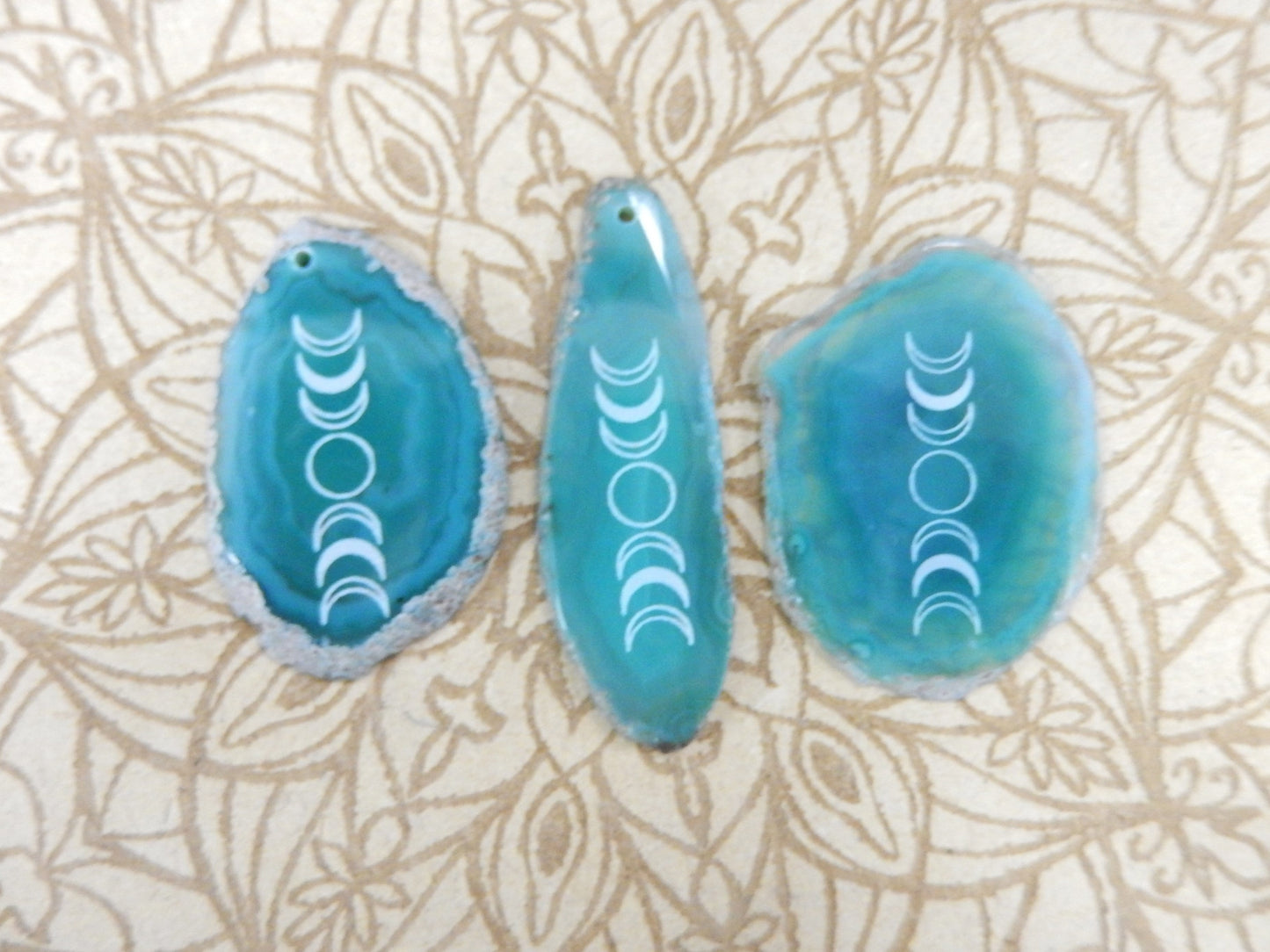 Picture of 3 of our green agate slices.