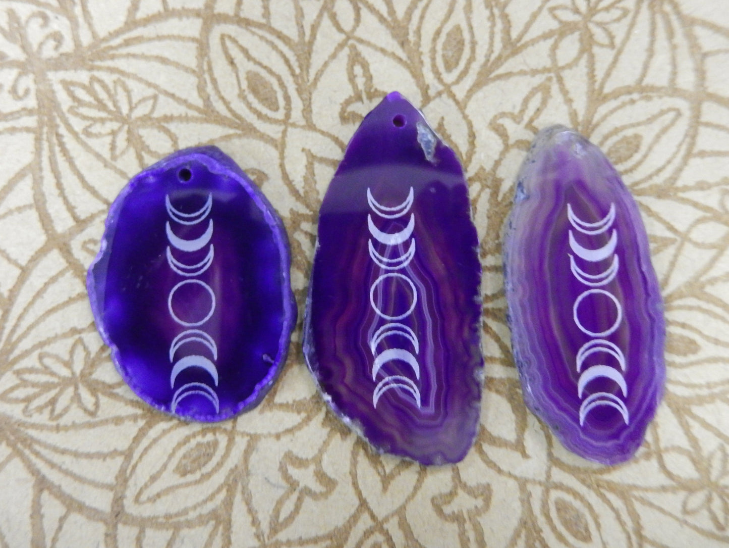 Picture of 3 of our purple agate slices.