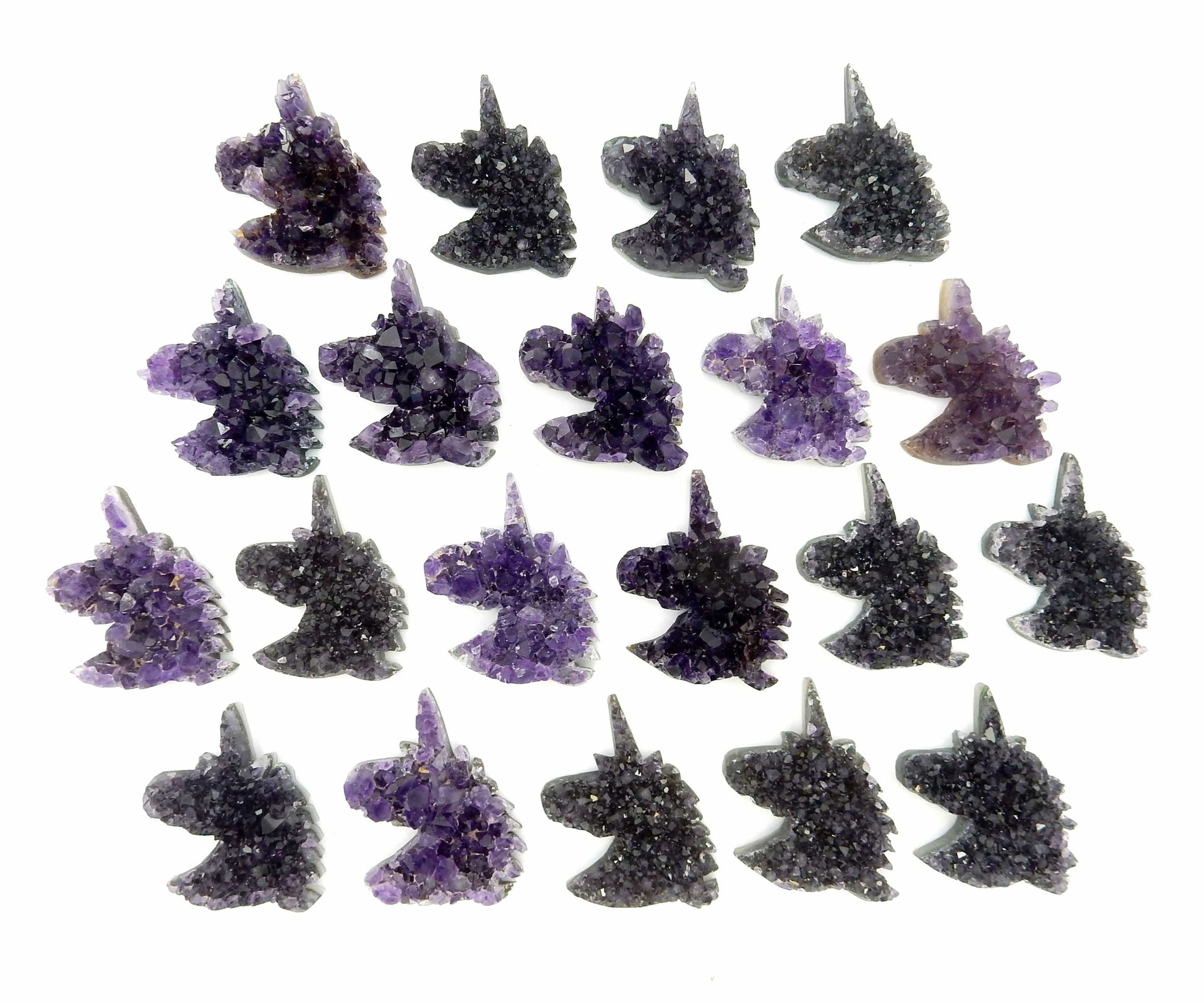amethyst unicorn cabochons on white background