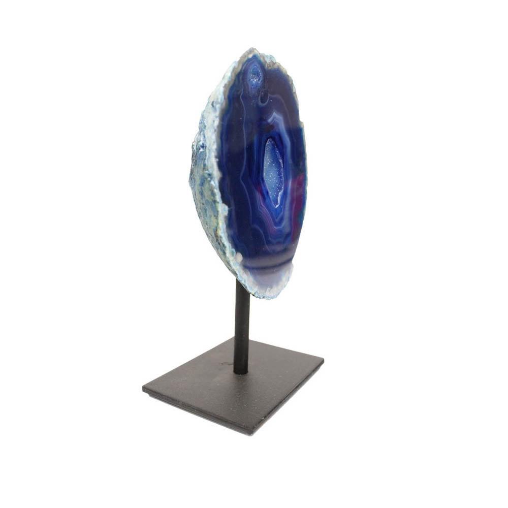 An angled agate geode on metal base with a white background.