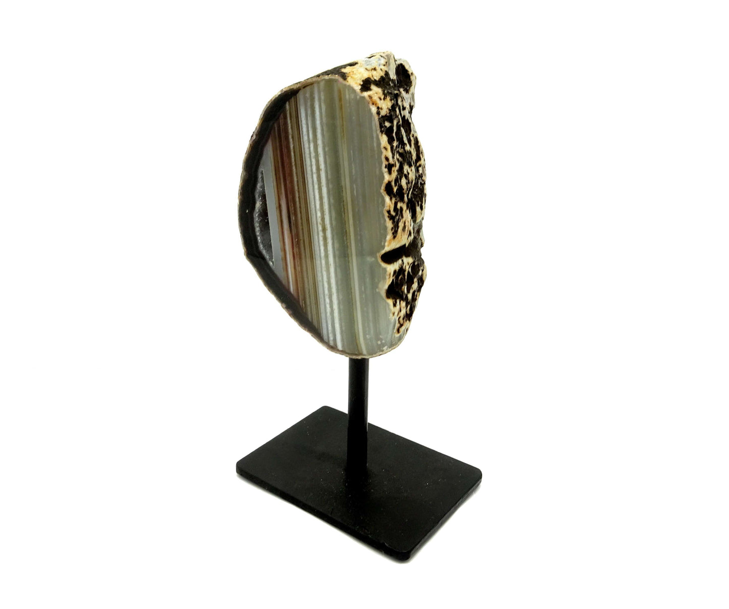One agate geode on a metal base with a white background.