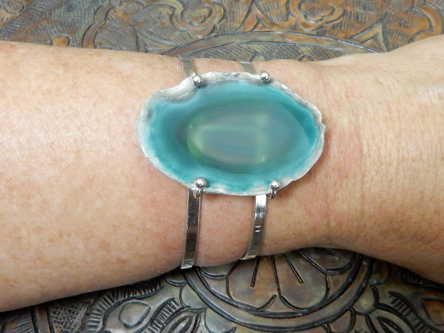 Green Agate Slice on Electroplated 24k Gold Adjustable Bracelet on a wrist.