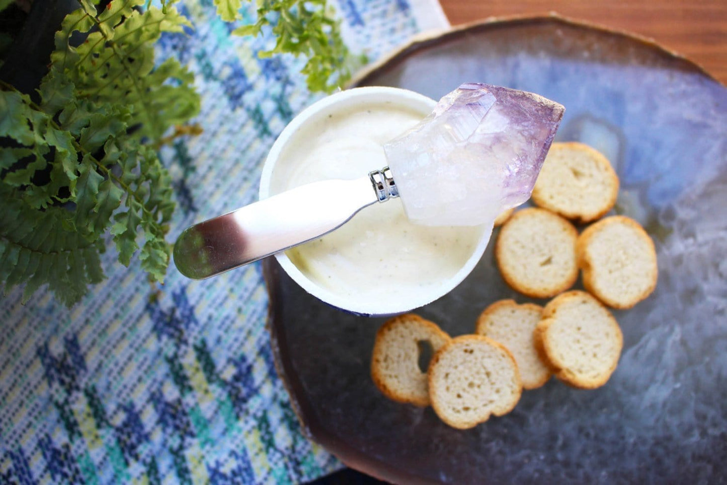 Amethyst Stone Butter Spreader displayed along side food