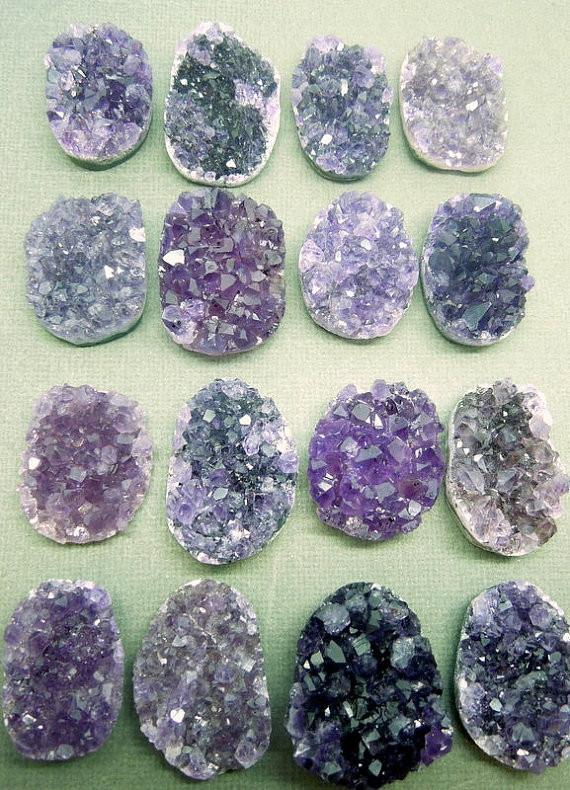 Multiple flat back amethyst cluster with different colors shapes.